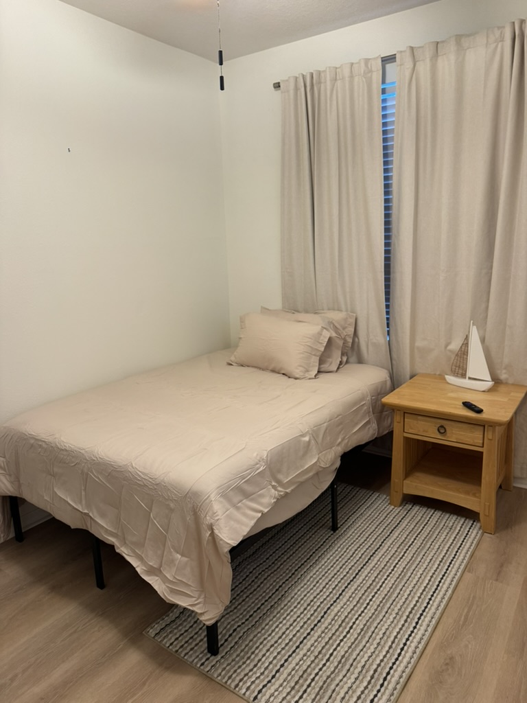 The same bedroom staged and furnished for room-share